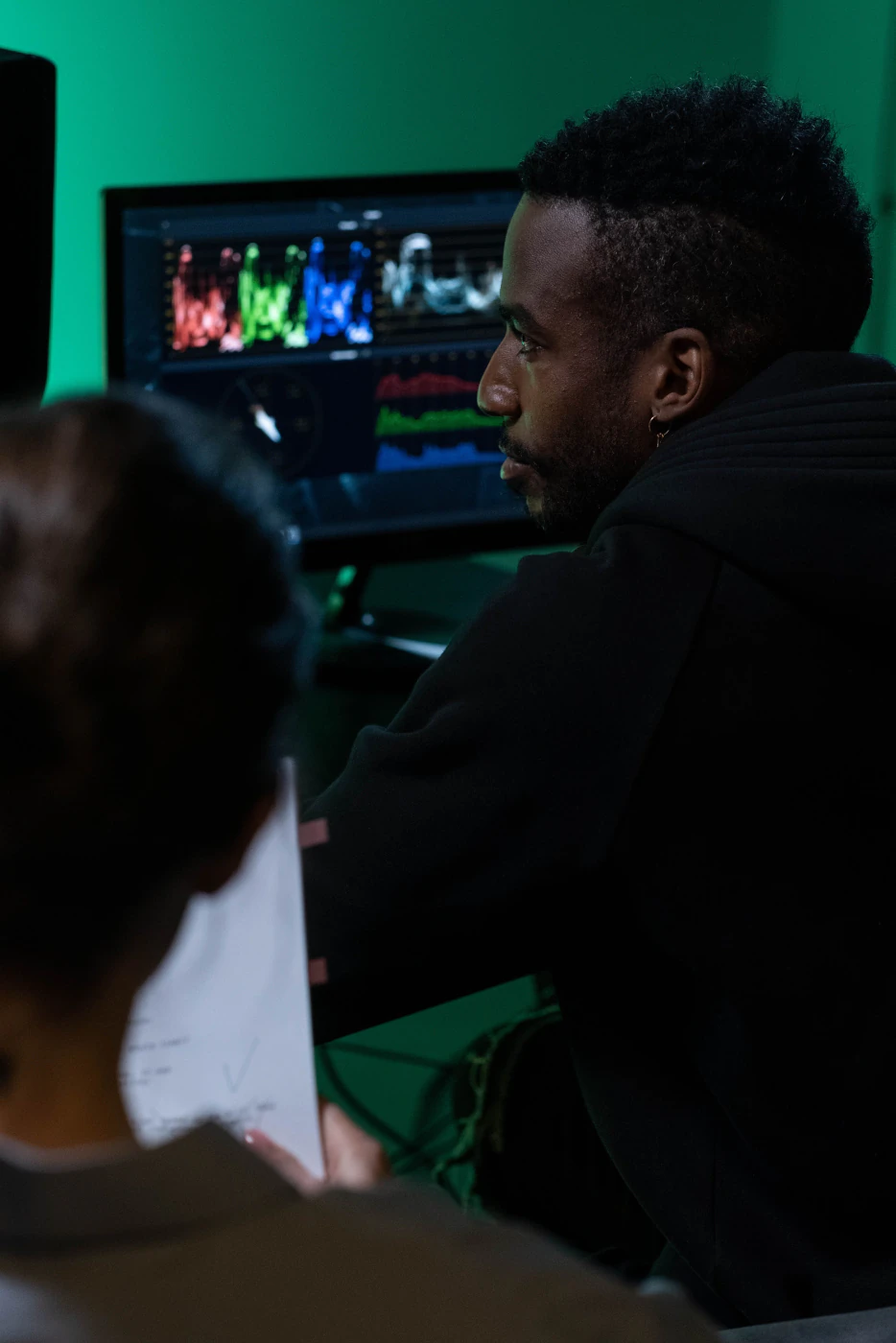 An engineer reviewing waveform data on a monitor