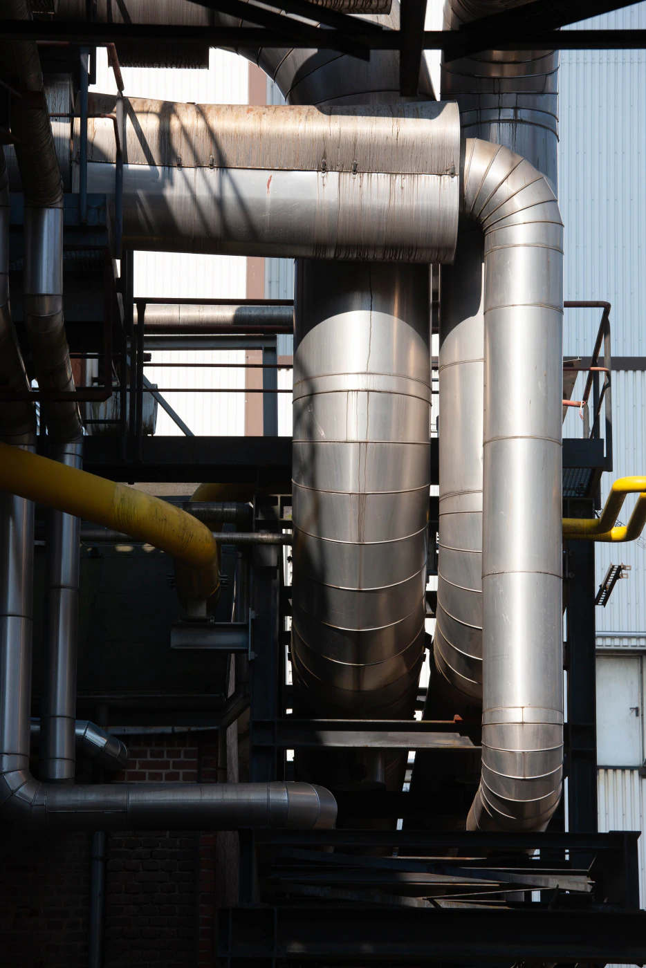 Insulated steel process piping running through a plant